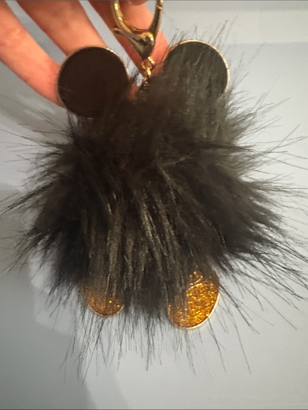 BaubleBar Black Fur Pom Key Charm with Gold Discs